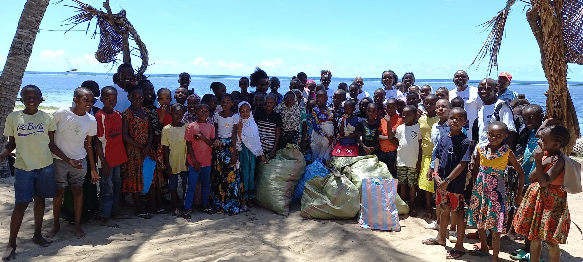 Group photo of the locals who cleaned the beach